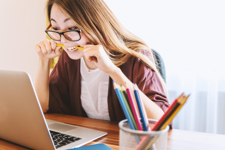 student studying desk notebook